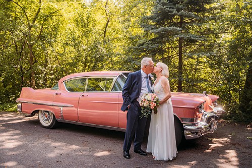 Bride and groom with 1957 Cadillac